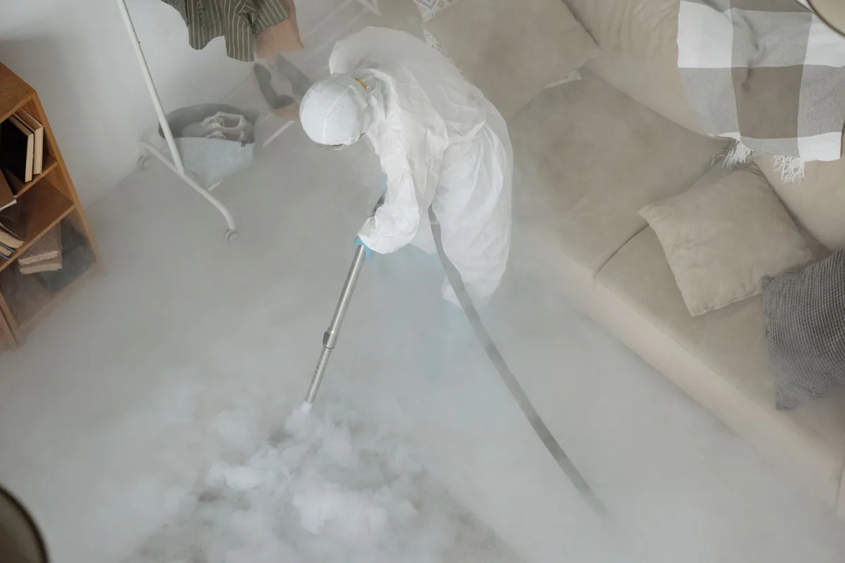 Biohazard cleanup technician in protective equipment, Mystic, CT
